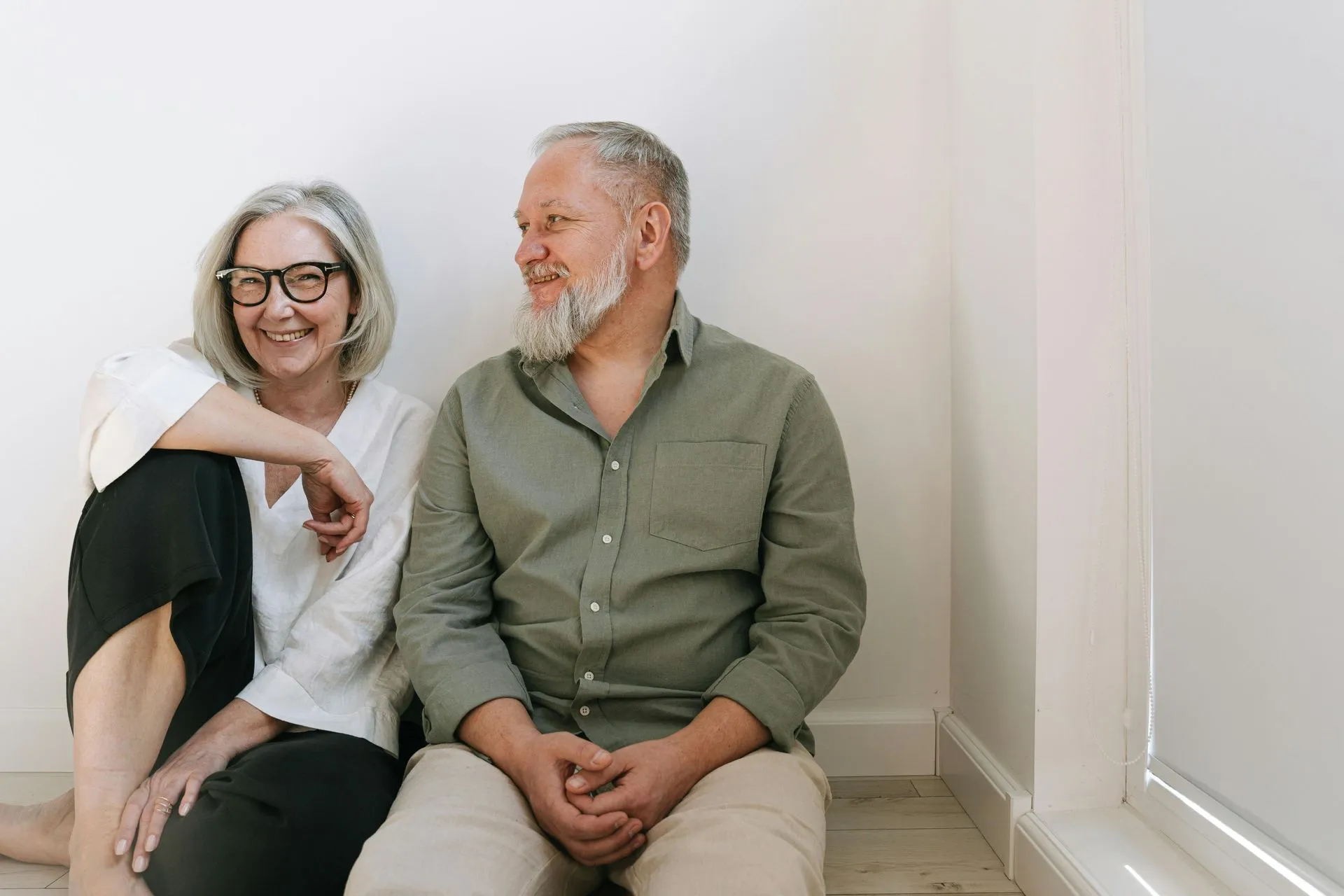 An older couple relaxing at home in a comfortable in-law suite